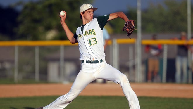 West High's Tanner Lohaus delivers a pitch during the Trojans' game against City High at West High on Tuesday, July 7, 2015.