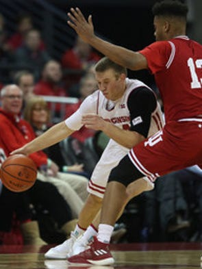 Wisconsin guard Brad Davison drives on Indiana forward