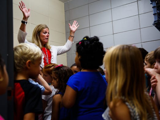 Teacher Sue Samuelson shows how to turn on the motion