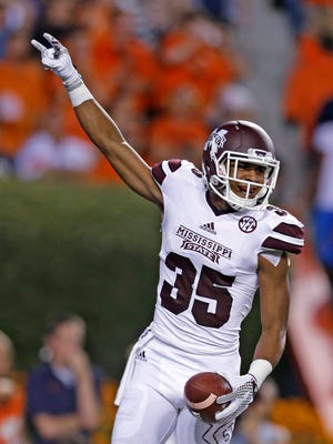 Mississippi State wide receiver Gabe Myles (35) celebrates after scoring a touchdown during the first half of an NCAA college football game against Auburn, Saturday, Sept. 26, 2015, in Auburn, Ala. (AP Photo/Butch Dill)
