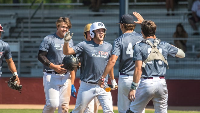 Members of The KC Club All-Stars celebrate after scoring a run during Tuesday's 11-10 win over the HoustonMVP Prospects at Hobart-Detter Field. With the win, KC will play the Hutchinson Monarchs on Wednesday, while HoustonMVP is eliminated from the NBC World Series.