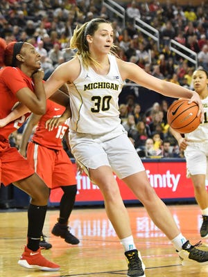 Ohio State forward Alexa Hart (22) tries to guard Michigan center Hallie Thome (30) in the fourth quarter.