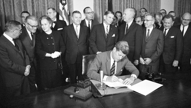 President John F. Kennedy signed a key mental health law on Oct. 31, 1963.