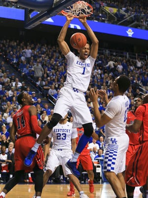Kentucky's Skal Labissiere jams down two with force during the Wildcats easy win over Ole Miss Saturday night at Rupp Arena.