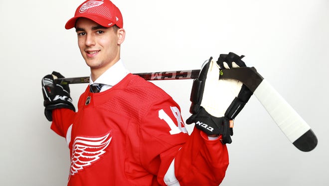 Joseph Veleno, the 30th pick of the first round Friday night, poses for pictures after being drafted by the Red Wings.