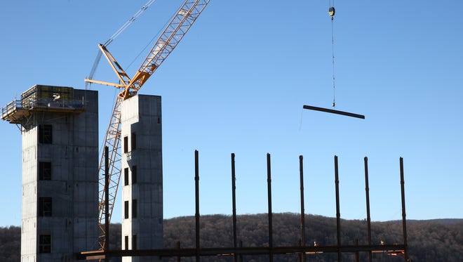 A crane moves a piece of steel at the Vassar Brothers Medical Center construction site in the City of Poughkeepsie on Thursday, January 25, 2018.