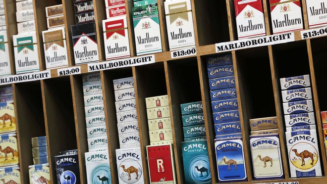 Cigarette packs are displayed at a convenience store in New York.