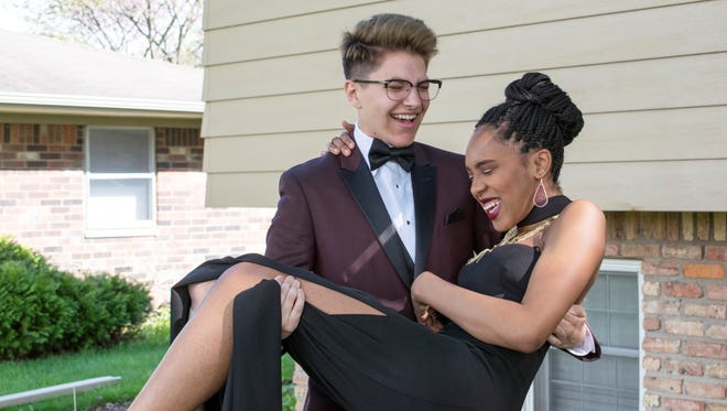 North Central High School junior Alan Belmont, 17, poses with his girlfriend, Hamilton Southeastern junior Anastacia Cohen before winning North Central's prom king