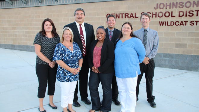 The Johnson City Central School District Board, pictured in August of 2016, is looking for applicants to fill a vacancy created by Debra Welsh Clark (center in red).