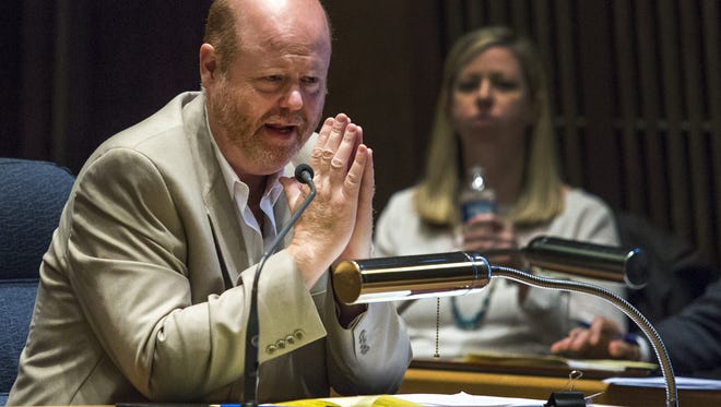New Castle County Councilman David Tackett speaks during a council meeting on April 28, 2015. The council is considering a plan to create fines for those who have standing water on properties.