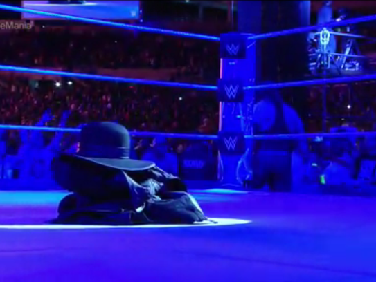 The Undertaker's gear remains in the ring after he