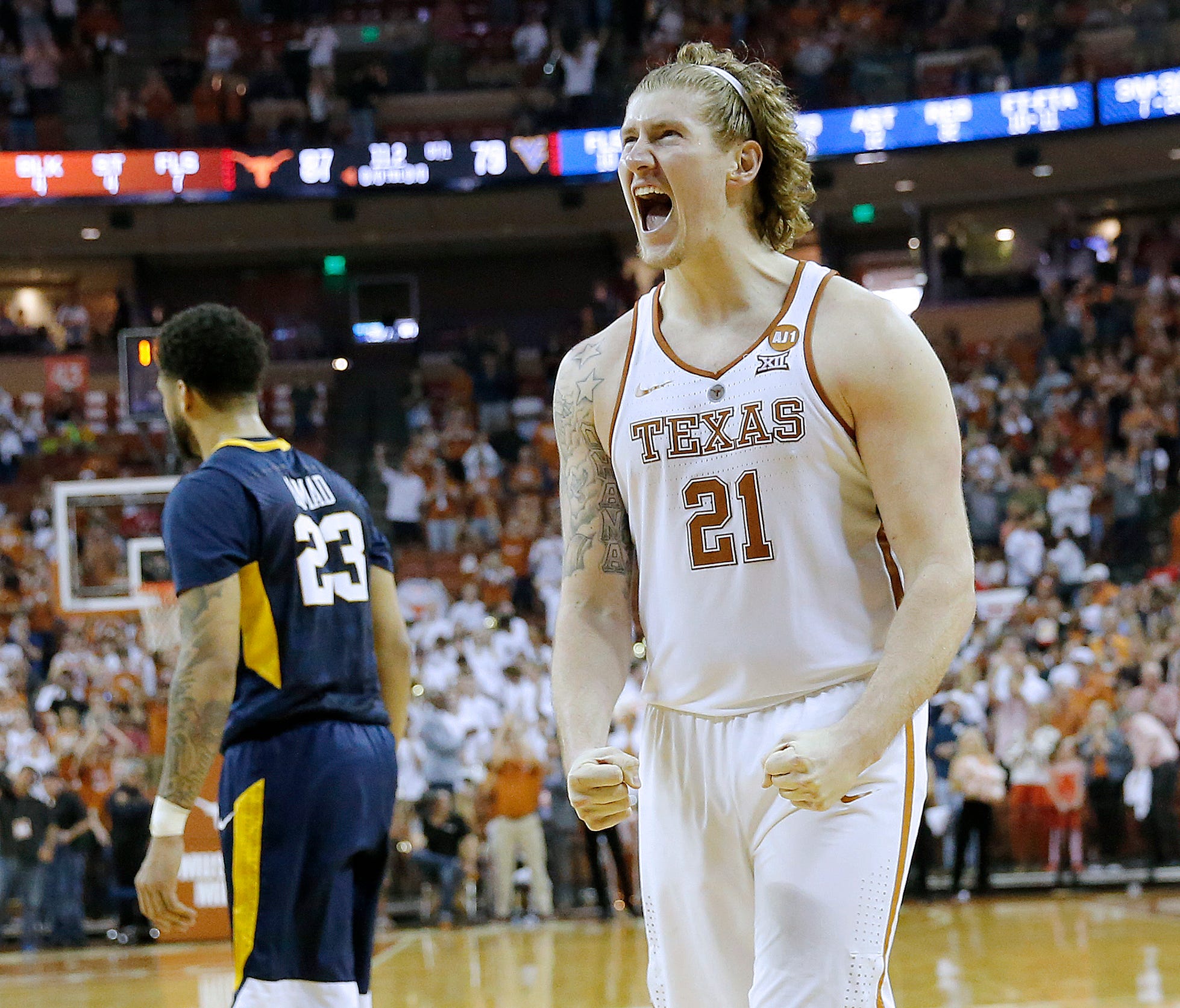 Dylan Osetkowski of the Texas Longhorns reacts as his team defeats the West Virginia Mountaineers 87-79 in overtime at the Frank Erwin Center on March 3, 2018 in Austin, Texas.