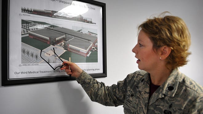 Lt. Col. Amy Russo, commander of the 82nd Medical Support Squadron, refers to an artist rendering for a proposed new clinic at Sheppard Air Force Base. The new facility will be more efficient and will serve about 20,000.
