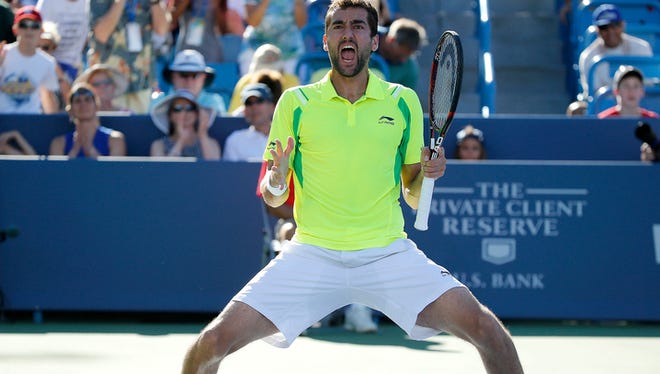 Marin Cilic celebrates after beating Andy Murray, 6-4, 7-5, to win the Western and Southern Open at the Lindner Family Tennis Center in Mason Sunday, August 21, 2016.