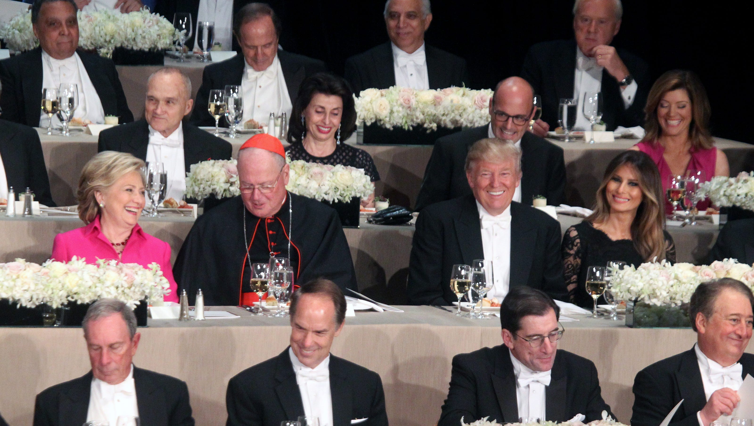 Trump, Clinton try for laughs at awkward Al Smith dinner