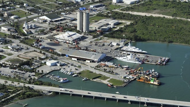 Two super yachts are seen Jan. 7, 2016, at the Port of Fort Pierce (center) and Fisherman's Wharf (left) along the Indian River Lagoon.