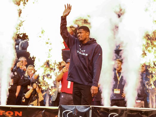 Houston Texans former player Andre Johnson waves to