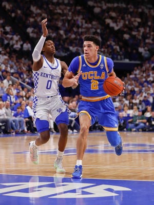 De'Aaron Fox, left and Lonzo Ball faced each other twice last season, with their teams splitting the games.