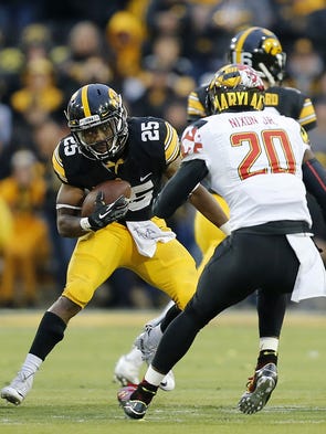 Iowa's Akrum Wadley cuts ahead for some of his 67 yards