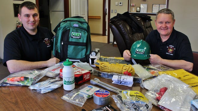 Berkley Fire Department Lt. Joe Inacio, left, and Deputy Chief Russell Horgan show off CERT backpack supplies in 2019. Inacio, who has been a Berkley on-call firefighter/paramedic for about a decade, is one of two new full-time firefighters. 

Taunton Gazette file photo