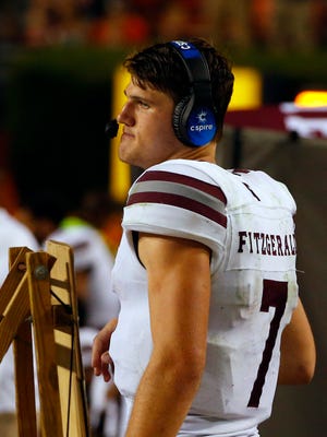 Mississippi State quarterback Nick Fitzgerald (7) walks the sidelines towards the end of an NCAA college football game as they fall to Auburn 49-10, Saturday, Sept. 30, 2017, in Auburn, Ala. (AP Photo/Butch Dill)