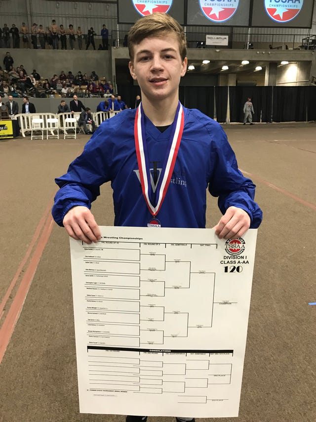 Harpeth's Dylan Becker shows off the bracket from the