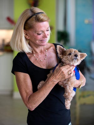 Louise Friedlander holds Tessa, her 10-year-old Yorkshire terrier, in her home in North Naples on Friday, July 28, 2017. Tessa went missing eight years ago, but on June 30, 2017, Tessa was found by Lee County Domestic Animal Services and was reunited with Friedlander.