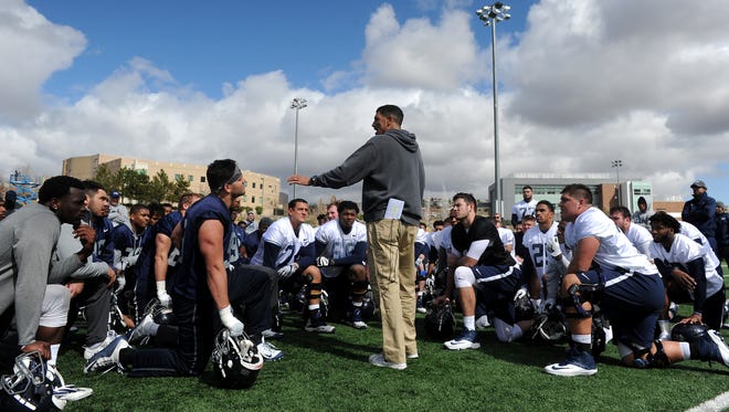 Nevada football coach Jay Norvell talks to his team during a 2017 practice.