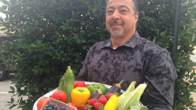 Anthony Iannone, owner of Anthony's Creative Italian Cuisine in Haddon Heights, shows off the types of fresh produce that SJ Hot Chefs will use during Farm to Fork Week.