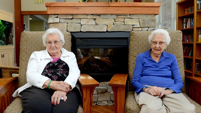 Maxine Rohlfs, left, and Eva Lewis, right, both residents at the Hope Landing assisted living facility in Charlotte, will celebrate their 100th birthday within days of one another later this month.