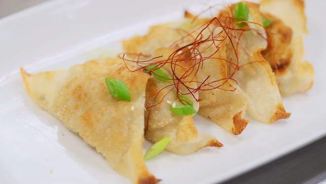 View of cabbage kimchi dumplings finished dish during Chef Judy Joo's Korean Food Made Easy class at The 8th Annual New York Culinary Experience Presented By New York Magazine And The International Culinary Center - Day 1 at New York Culinary Experience on April 16, 2016 in New York City.