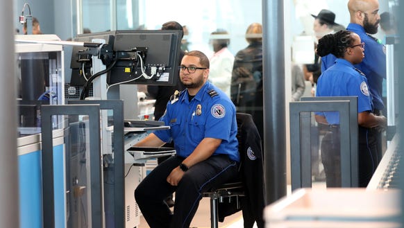 A Transportation Security Administration (TSA) screener