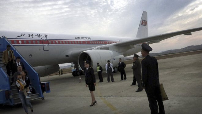 Passengers disembark from an Air Koryo flight in Pyongyang, North Korea, on Oct. 21.