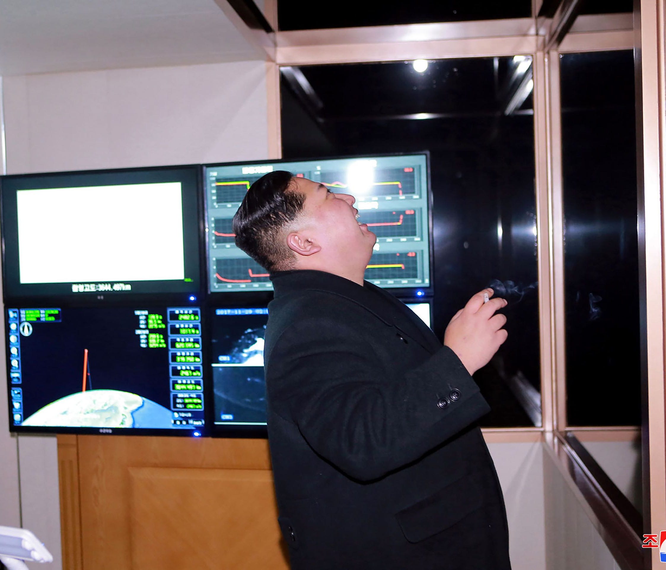 This photo taken on Nov. 29, 2017 and released on Nov. 30, 2017 by North Korea's official Korean Central News Agency (KCNA) shows North Korean leader Kim Jon Un looking at launching of the Hwasong-15 missile.