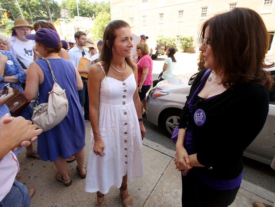 Tammy Snyder Murphy, l, wife of NJ Gubernatorial candidate Phil Murphy, speaks with Saily Avelenda of NJ 11th for Change, attending the weekly "Fridays with Frelinghuysen" rally