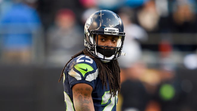 Seattle Seahawks cornerback Richard Sherman (25) looks on during the fourth quarter against the Carolina Panthers in a NFC Divisional round playoff game at Bank of America Stadium.