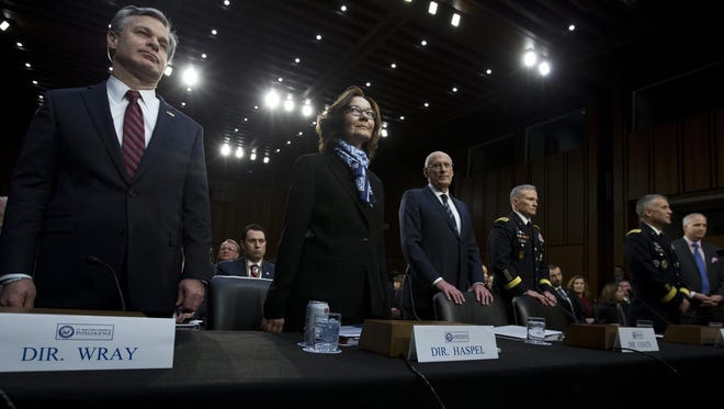 From left, FBI Director Christopher Wray, CIA Director Gina Haspel and Director of National Intelligence Daniel Coats, Defense Intelligence Agency Director Gen. Robert Ashley, National Security Agency Director Gen. Paul Nakasone and National Geospatial-Intelligence Agency Director Robert Cardillo testify before the Senate Intelligence Committee on Capitol Hill in Washington, Jan. 29, 2019.