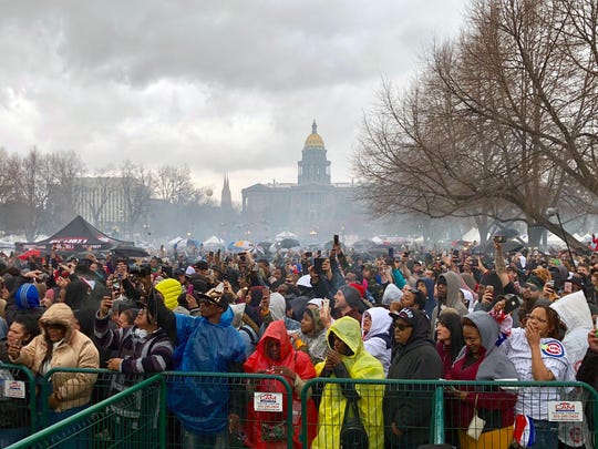 A heavy cloud of marijuana smoke hangs over the Denver 420 festival on Friday, April 20, 2018.