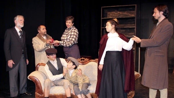 "Enemy of the People" is at the Las Cruces Community Theatre. Actors include, from left, standing, David Edwards, Ed Montes, Sarah Sayles, Jessie Montoya Ortega and Spencer Taylor; and on couch, from left,  Christopher Hamilton and Santiago Garzon.