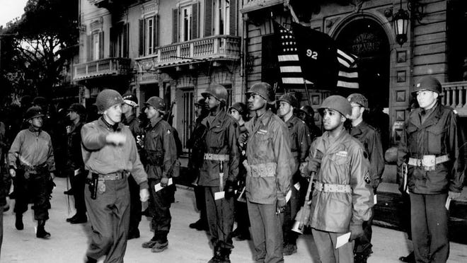 Members of the 366th Infantry Regiment, part of the all-Black Buffalo Soldiers, stands at attention during a campaign in Italy in 1944. Calvin Johnson, the author's brother, served in the regiment.
