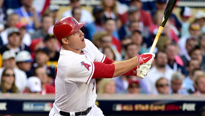 American League outfielder Mike Trout (27) of the Los Angeles Angels hits an RBI triple in the first inning during the 2014 MLB All-Star Game at Target Field in Minneapolis on July 15, 2014.