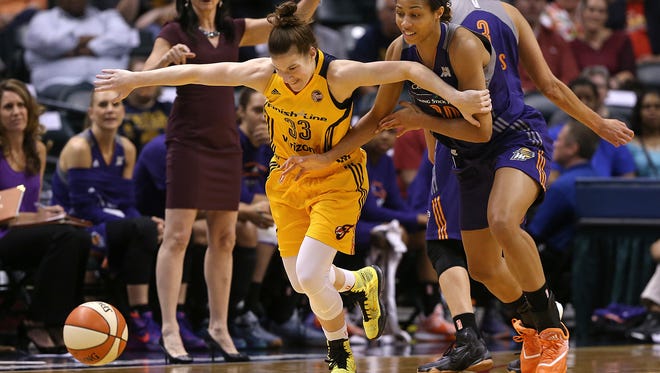 Phoenix Mercury center Isabelle Harrison (20) fouls Indiana Fever guard Maggie Lucas (33) in the first quarter during an Indiana Fever game against Phoenix Mercury, Banker's Life Fieldhouse, Indianapolis, Wednesday, May 18, 2016.