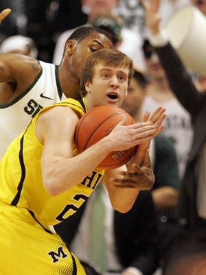 Michigan State guard Keith Appling forces a time-out by Michigan guard Spike Albrecht during the first half action on Feb.12, 2013 at the Breslin Center.