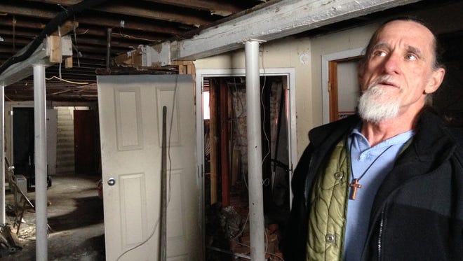 David Phelps, pastor at the Free Methodist Church on Elmwood Avenue, in the basement of the church. The basement is all that is left of the property after a fire last year caused substantial damage to the structure.