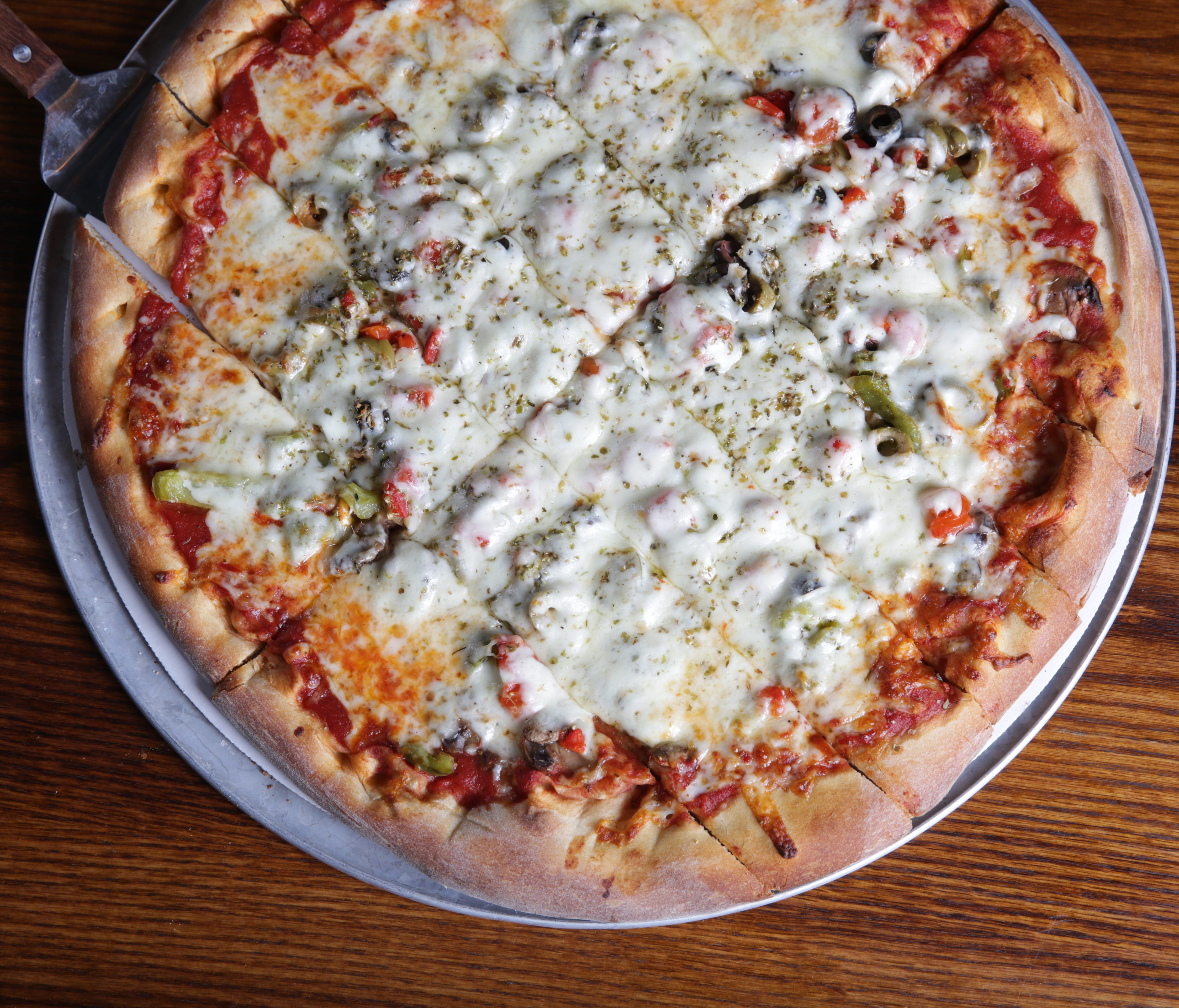 In line with Quad Cities tradition, Roots pizza dough contains a malt-heavy 
