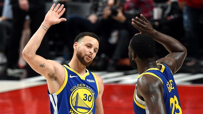 Stephen Curry (left) celebrates with Draymond Green during the second half against the Portland Trail Blazers in Game 3 of the NBA Western Conference Finals at Moda Center on May 18, 2019.