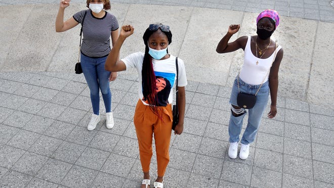 From left, high school students Kiara Cruel, Faith Quinnea and Ayee Yeakula are organizing a protest of black lives taken, planned for 4:30 p.m. Friday at Kennedy Plaza.