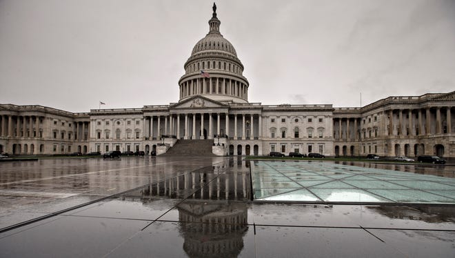 The U.S. Capitol is seen as heavy rain sweeps through Washington on Oct. 7, 2013.