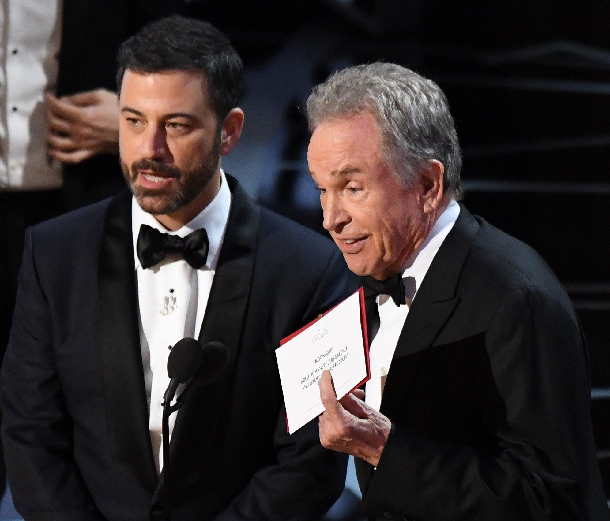 Warren Beatty explains to the audience how he had the wrong award card for best picture during the 89th Academy Awards at Dolby Theatre.
