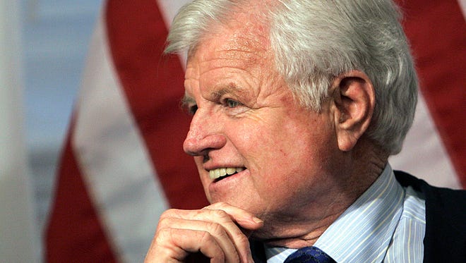 In this Feb. 4, 2005, file photo, then-senator Ted Kennedy, D-Mass., participates a bill-signing ceremony at the Statehouse in Boston.